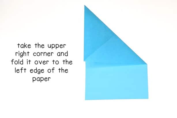 step 5 - fold the right corner over to the left edge of the paper