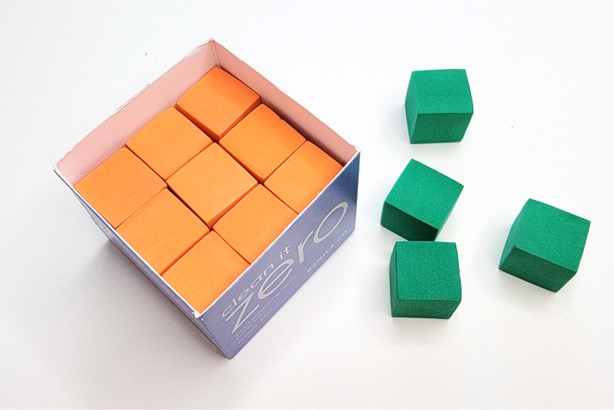 a small box from home filled with 1 inch cubes to find the volume